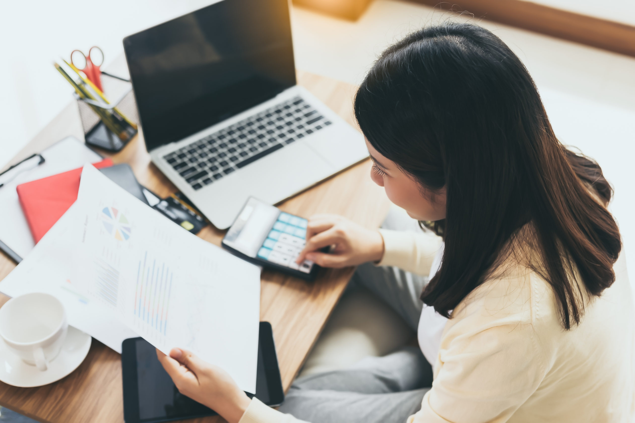 Woman making a financial checklist